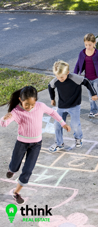 Kids Playing Hopscotch in Driveway